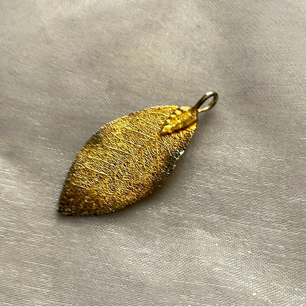 Gold dipped leaf pendant. Rustic edges.